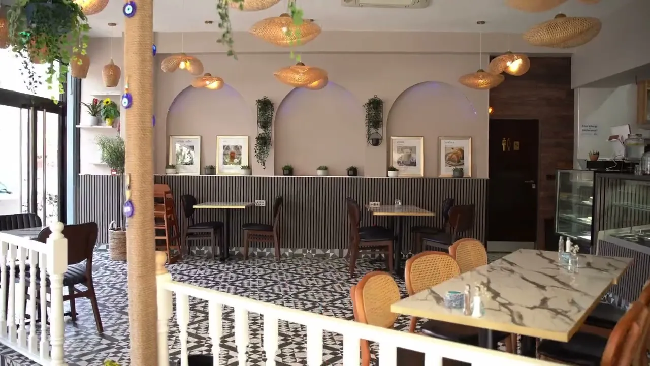 Tables by the arched wall
