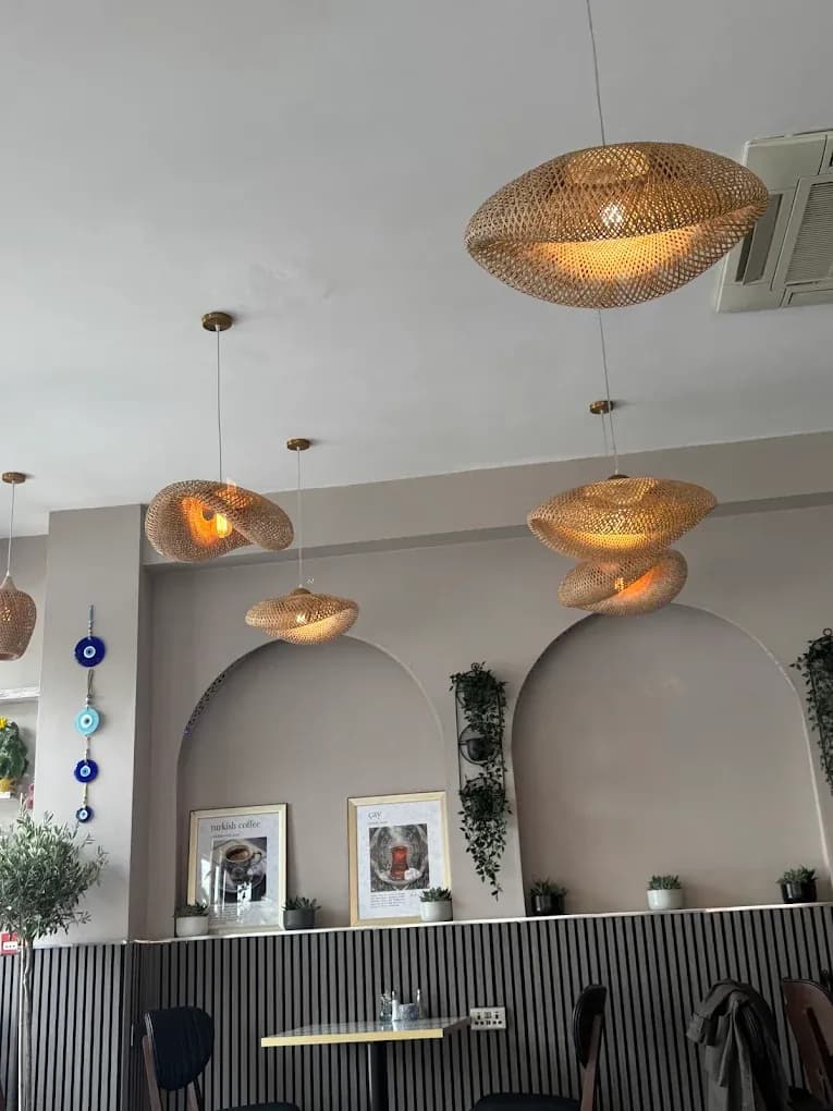 The dining room: arched niches, rattan lamps and nazar beads